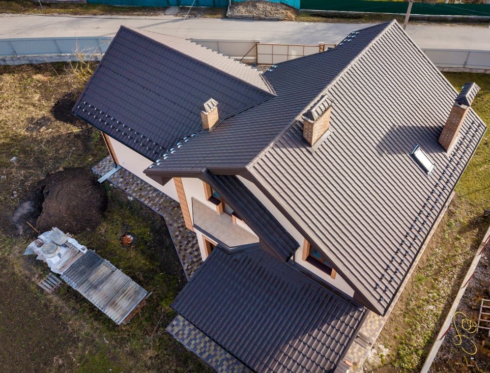 Arial view of residential home with newly installed metal roofing