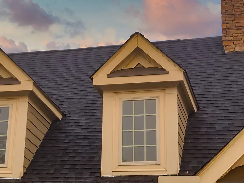 Large residential roof at dusk