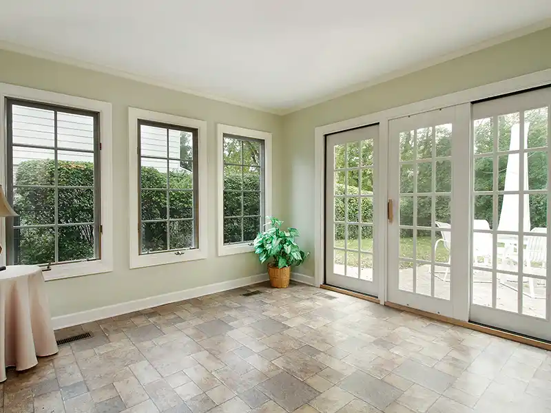 Room with windows and patio door
